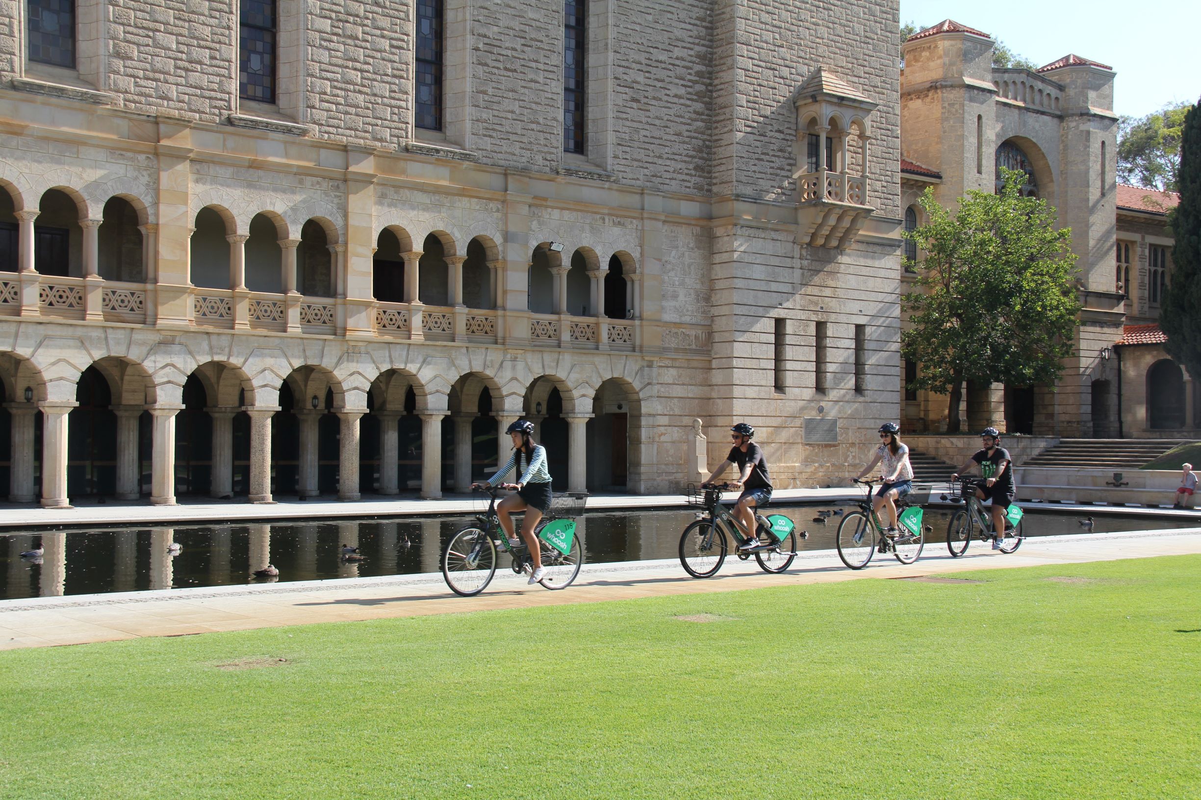 Students riding Whoosh bikes