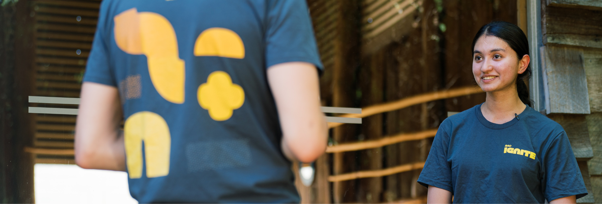 Photo of Chandini talking to Ben. 