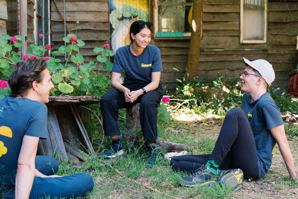 Chandini sitting with Ben and Troy