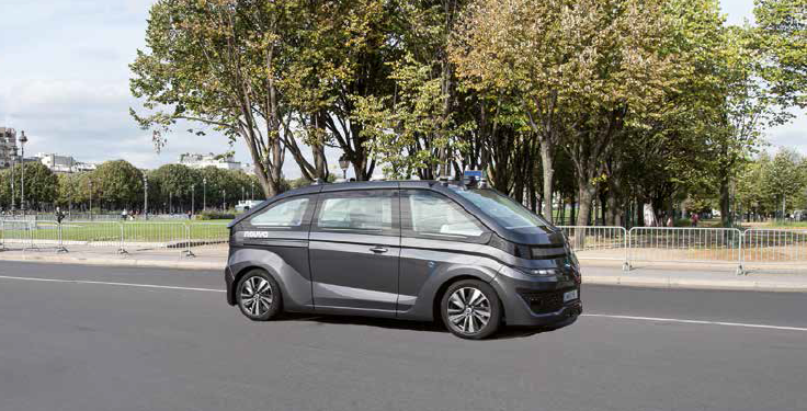 Photo of a Navya driverless car on an open road
