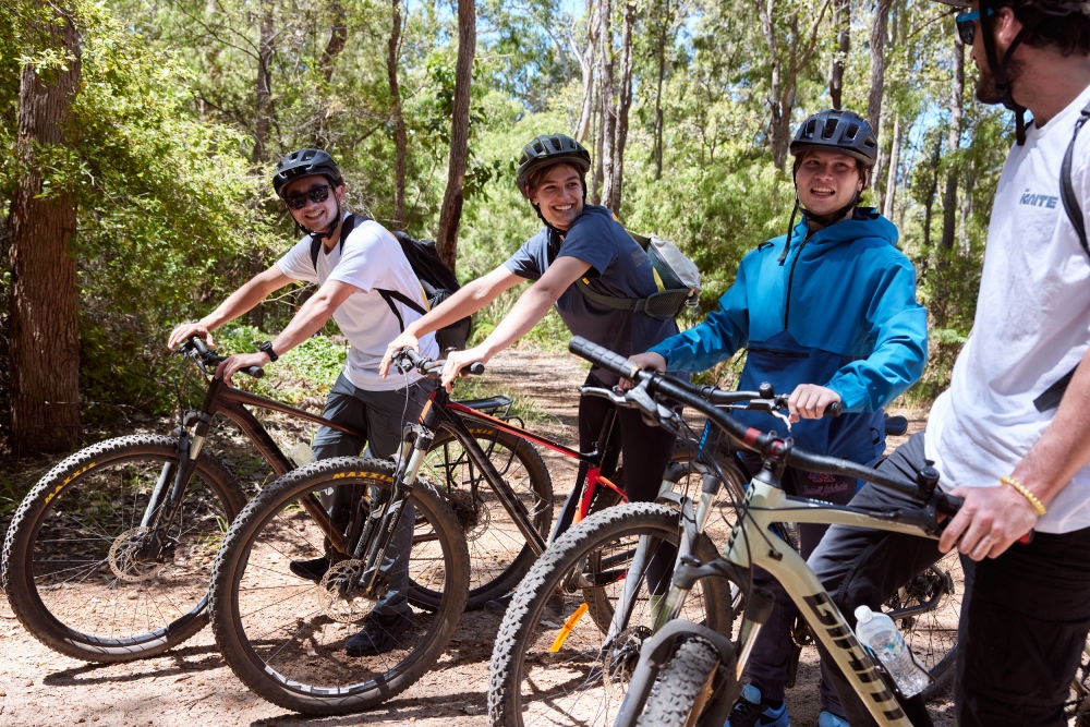 Young people riding bikes who are on an Ignite youth camp