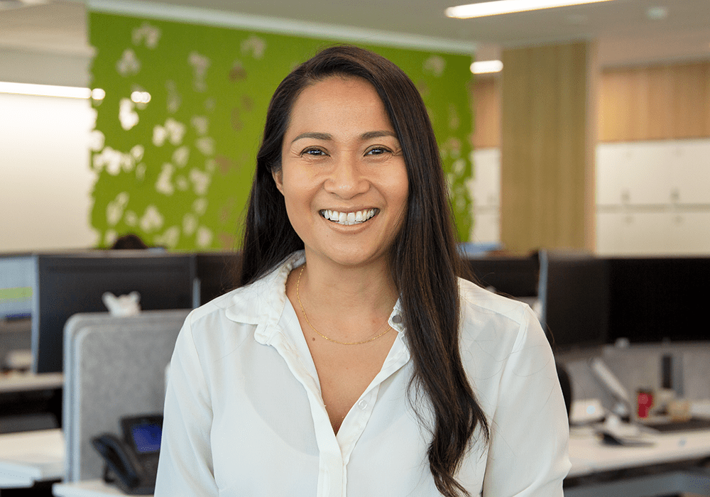 Woman smiling with long dark hair