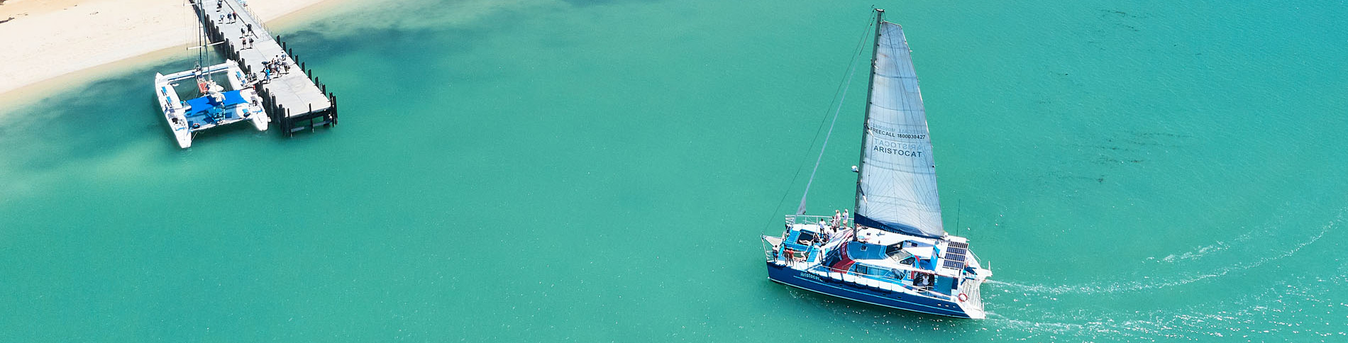 Yacht sailing green sea