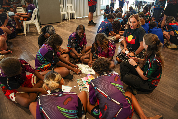 Children sitting on the floor in a hands‑on learning workshop in the Kimberley region.