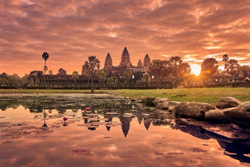 Angkor Wat's vast temple complex of intricate stone buildings at sunrise