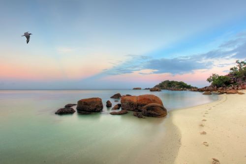 A tranquil beach on Lizard Island at sunset