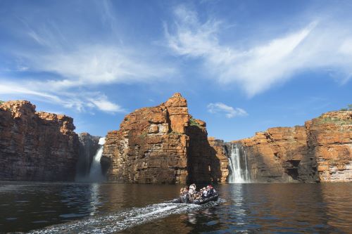 A zodiac with passengers cruising near King George Falls
