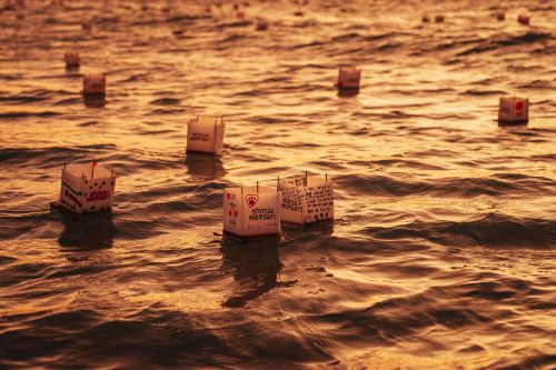 Shinju lanterns in the water at sunset.