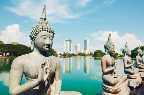 Buddha statues beside Beira Lake in Colombo, Sri Lanka