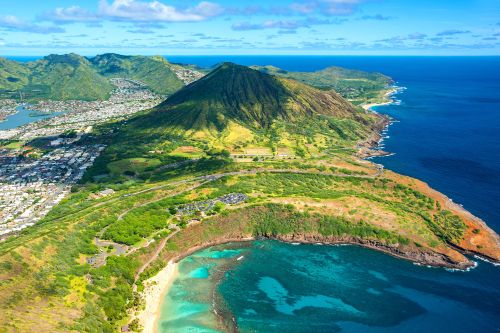 Aerial view of Diamond Head crater and turquoise bays along the Honolulu coastline