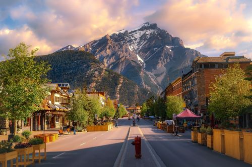 Sunrise clouds over a mountain road through the town of Banff.