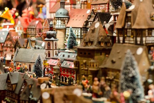Close-up of ceramic miniature incense houses in a Christmas Market stall.