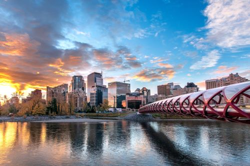 Peace Bridge leading into the city of Calgary at sunset. 