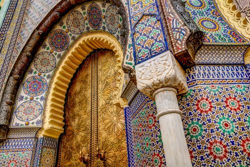 Intricate tile patterns, metal work and plaster carvings adorning building exteriors in Fez.