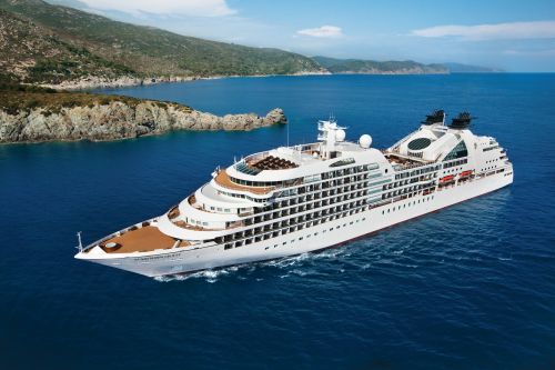 Seabourn Quest sailing along a scenic coastline