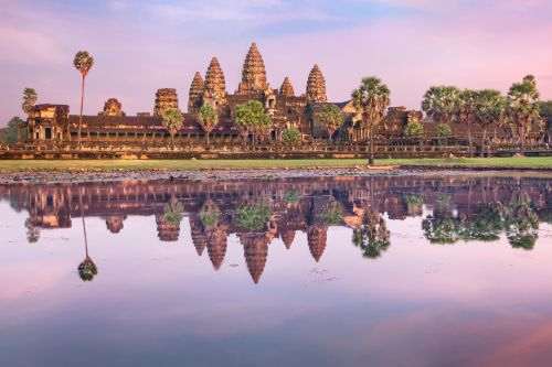 Sunrise view of Angkor Wat reflected in a tranquil pond