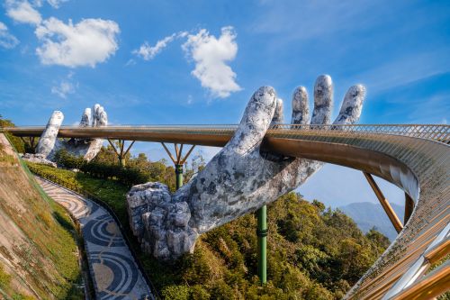 Golden Bridge held by giant stone hands in Da Nang.