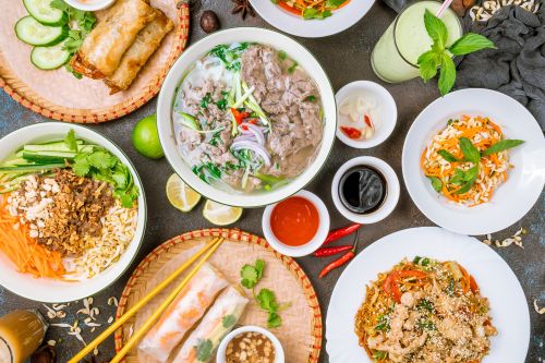 Traditional Vietnamese dishes served on a dining table.