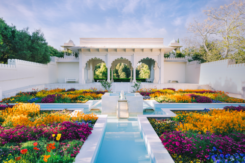 Formal garden with fountain and vibrant flower beds
