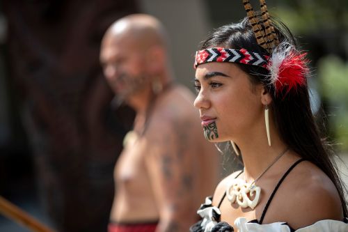 Two people in traditional Māori dress.