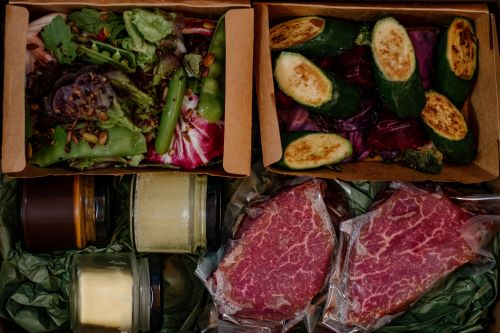Top-down view of a dinner board offering local produce to enjoy. 