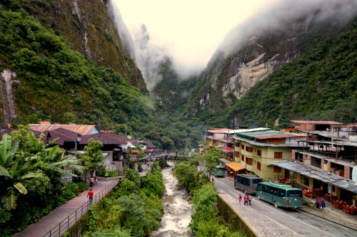 Aguas Calientes, Peru, nestled between misty mountain peaks