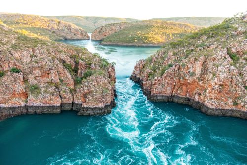 Water flowing through the narrow gaps in the ranges creating Horizontal Falls, an ocean phenomenon.