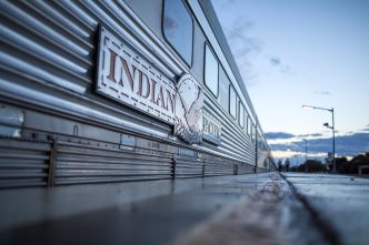 The Indian Pacific parked at platform with focus on the logo on one of the carriages