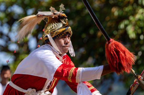 A tribal Indonesian individual displaying a cultural performance