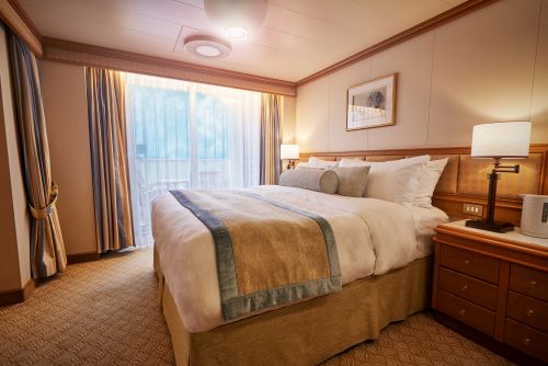 The inside of a balcony stateroom aboard a Princess vessel