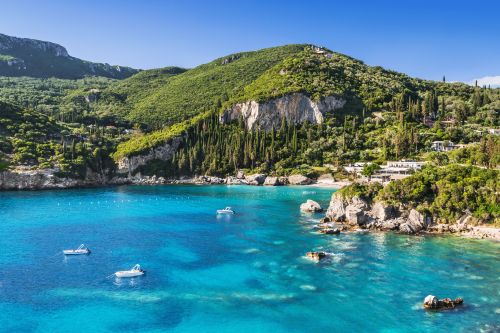 A bay surrounded by cliffs covered in lush greenery