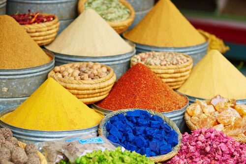 Bowls of bright coloured spices in a Moroccan spice market