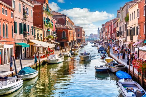 Canals in Venice lined with buildings and gondolas
