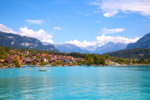 Picturesque Swiss landscape with mountains and a small village by the lake