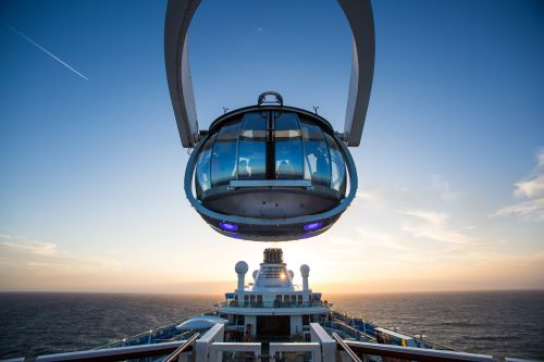 The North Star, a glass-enclosed observation pod offering panoramic views of the sea and sky floating above the ship.