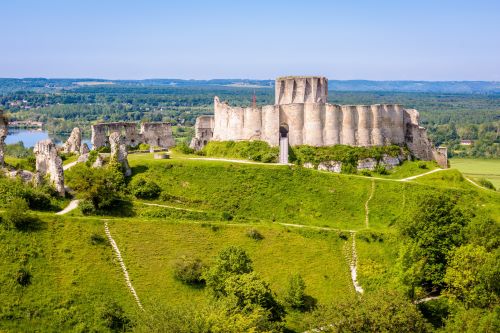 An old Chateau in Normandy surrounded by lush greenery