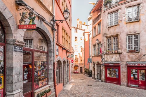 A town in France with cobblestone and old buildings 
