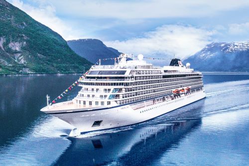 Cruise ship on the ocean in Eidfjord Norway with mountains in the background